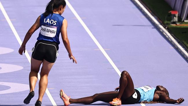 Silinia Pha Aphay went back as quick as she could. Photo by Anne-Christine POUJOULAT / AFP.