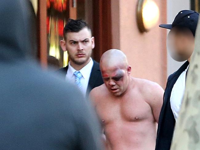 Police arrest a man after raiding a house at Darlinghurst Road. Picture: John Grainger