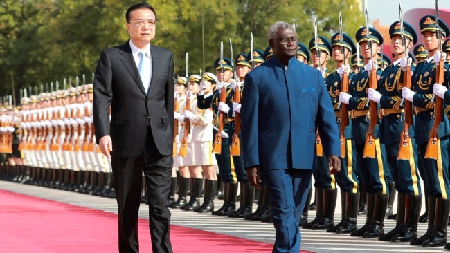 Chinese Premier Li Keqiang and Solomon Islands' Prime Minister Manasseh Sogavare ahead of their talks at the Great Hall of the People in Beijing, capital of China, Oct. 9, 2019. Photo by Pang Xinglei/Xinhua via Getty Images.