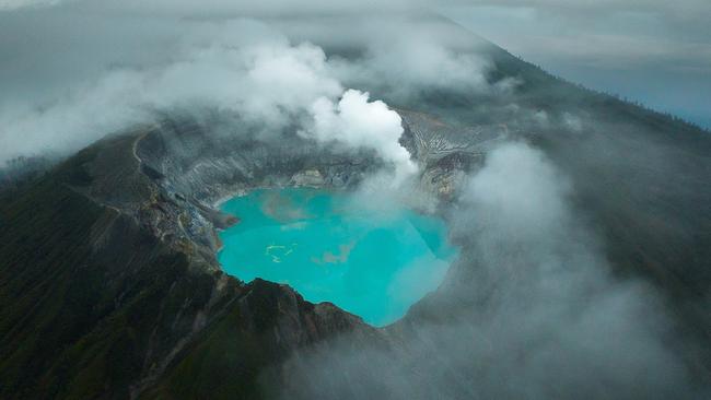 EMBARGO FOR TWAM, 15 FEBRUARY 2025. FEE MAY APPLY. Sulphur mining Kawah Ijen Vvolcano, East Java, Indonesia. The Ijen volcano crater in Banyuwangi, is a tourist destination popular for its blue fire phenomenon, but beyond the selfies and long-exposure images are some of the last men in the world to hand-mine sulfur.  It is some of the most physically demanding and dangerous work in the world, but these men are proud to use their physical strength to provide for their families and still manage to find joy and pleasure in their work. Photo: Filippo Falco