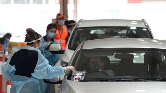 People get COVID tests at a testing station at Mickelham Rd, Tullamarine. Picture: Andrew Henshaw.