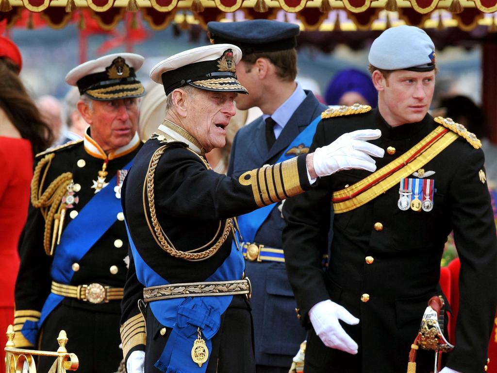 Prince Harry with his grandfather on-board the Spirit of Chartwell during the Thames Diamond Jubilee Pageant on the River Thames in London. Picture: AFP