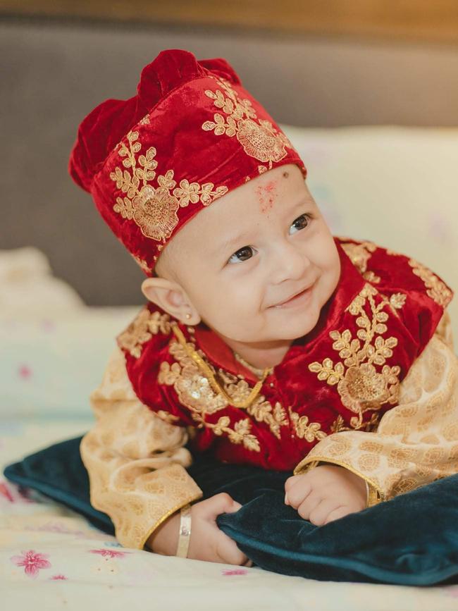 Kiaan Bhattarai in traditional outfit for his first meal. Kiaan gave a beautiful smile on his weaning day while his parents were cheering for him from the other side. Picture: Suresh Bogati