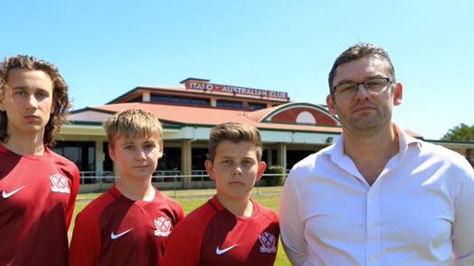 Martin Calvert (right), Chair of the proposed Queensland Football School with students.