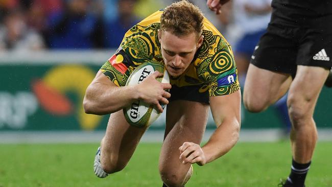 Reece Hodge scores a try in the early minutes of play.