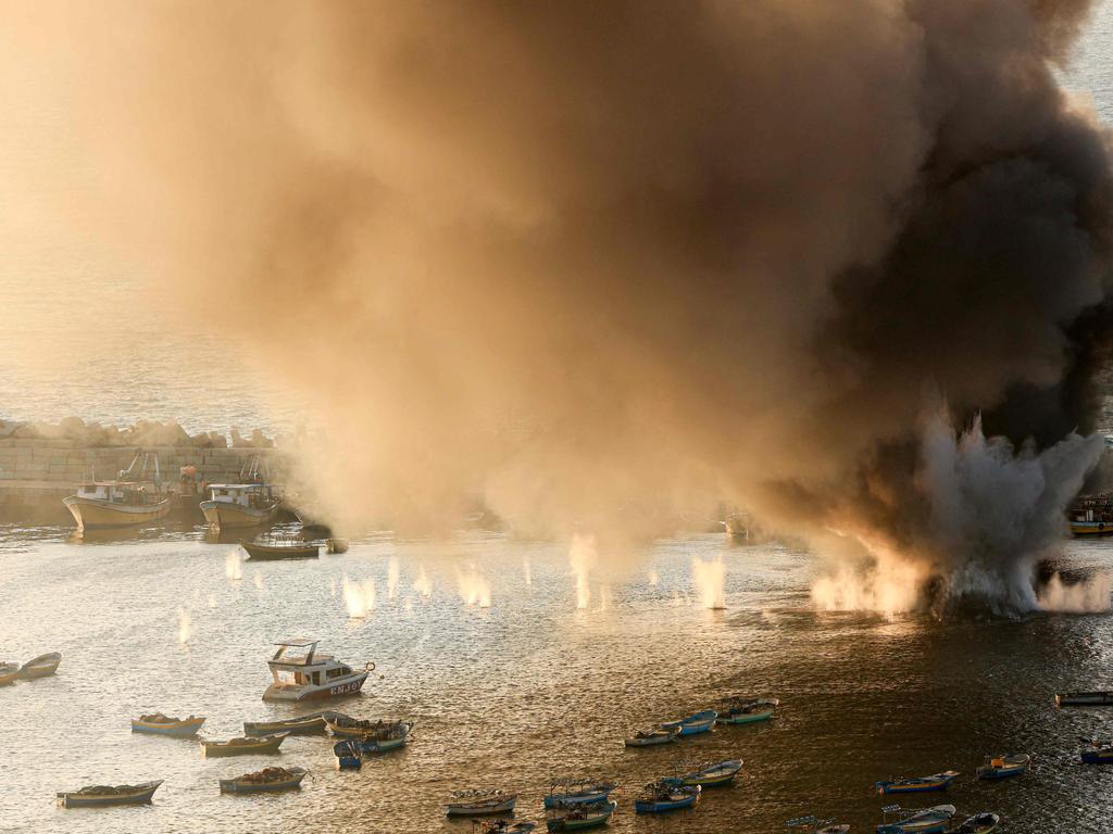 Smoke billows after a strike by Israel on the port of Gaza City. Picture: AFP