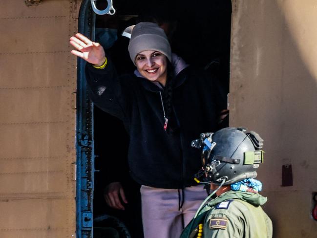 Newly-released Israeli hostage Daniella Gilboa waves as she leaves a military helicopter following more than 15 months in captivity. Picture: Yossi Zamir/AFP