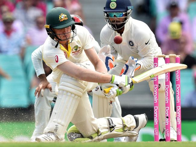 Australia's batsman Marnus Labuschagne sweeps a ball on day three of the Sydney Test.