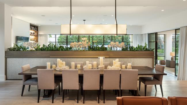 Floor-to-ceiling windows flood indoor spaces with natural light.
