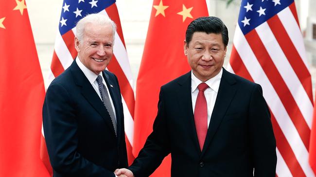 Chinese President Xi Jinping, right, shakes hands with then-US Vice President Joe Biden in 2013. Picture: AFP