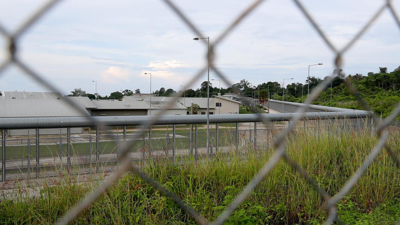 Australia is keeping its evacuees behind wire fences. Picture: AAP Image/Richard Wainwright