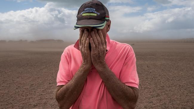 HOLD for HERALD SUN. CONTACT PIC DESK. Victorian Drought. Farmers in the Giffard West region of Gippsland in Victoria are doing it tough. They have not seen significant rain fall since October 2017. Farmer Dan Boland wipes dust from his eyes after strong winds kicked up a dust storm at his property in Darriman. Picture: Jake Nowakowski