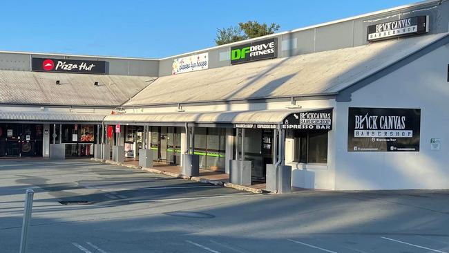 The Carina shopping complex where a barber shop was gutted by a suspicious fire overnight.