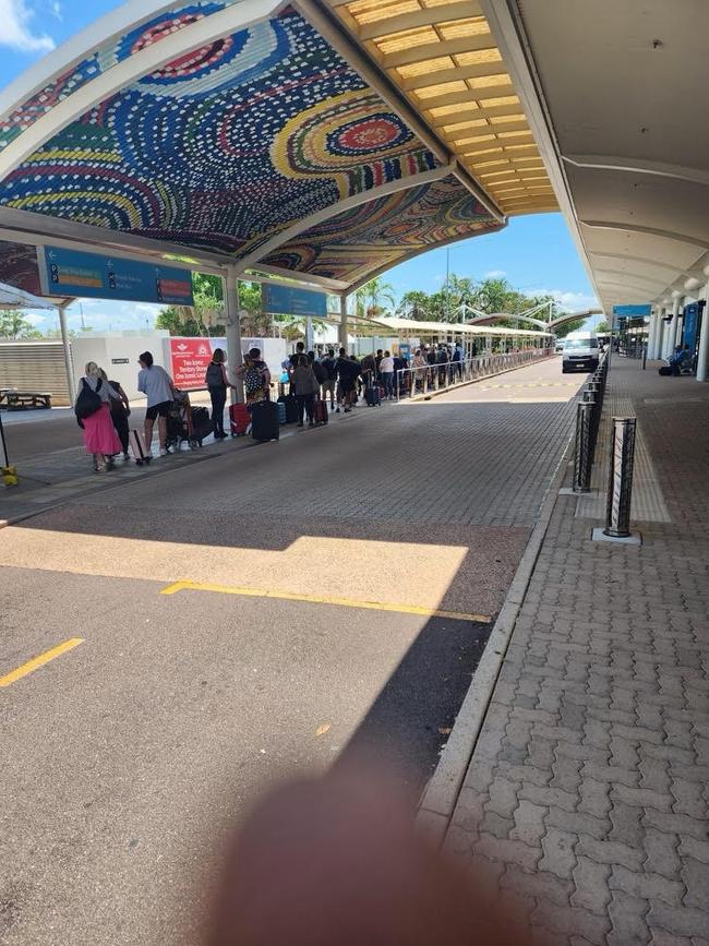 Travellers wait for taxis at Darwin International Airport
