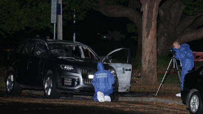 A car believed to have been used in the execution is found burnt out in Concord. Picture: Bill Hearne