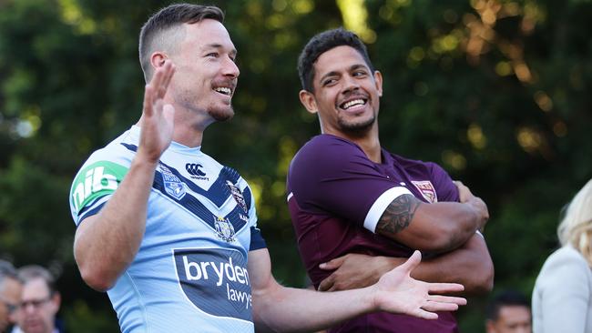 Damien Cook and Dane Gagai keep it lighthearted before battle commences. Image: Brett Costello