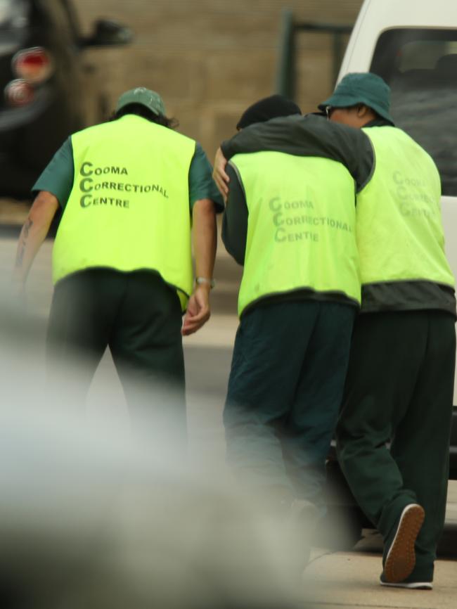 Some of the prisoners get chummy on the job. Picture: John Grainger