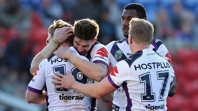 Storm players celebrate a try.