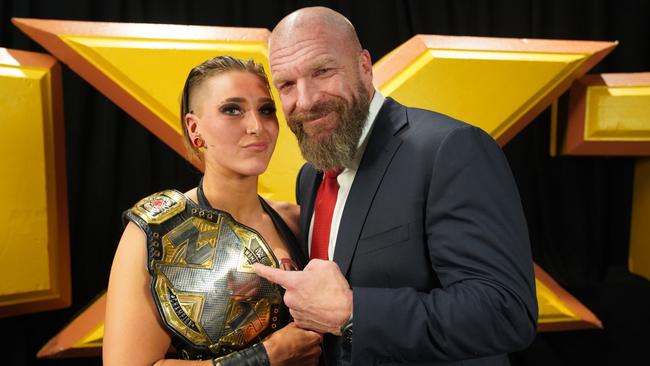 Rhea Ripley celebrates her NXT women's championship win in December with WWE legend Triple H. Picture: WWE