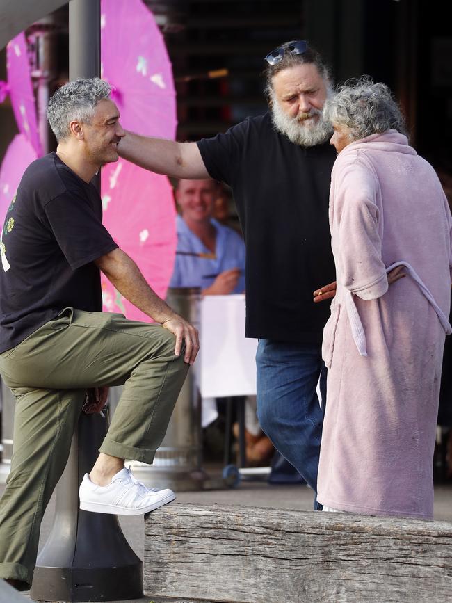 Thor director Taika Waititi and Russell Crowe chat with a local woman at Woolloomooloo wharf. Picture: Sam Ruttyn