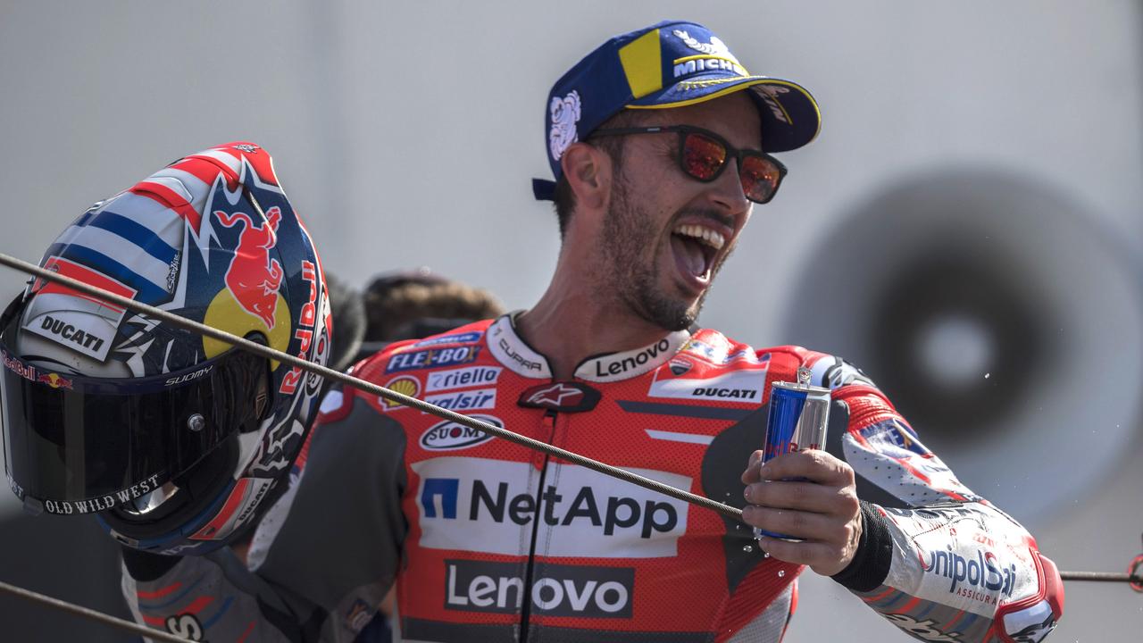 Dovizioso celebrates his victory on the podium at San Marino in 2018.