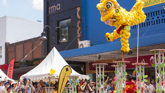 A crowd watches a lion dance at the 2018 Lunar New Year celebrations at Eastwood. Picture: Matthew Vasilescu