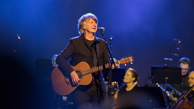 Neil Finn backed by an orchestra, at an open-air show at the Gold Coast’s new Home of the Arts. Pic Luke Marsden.