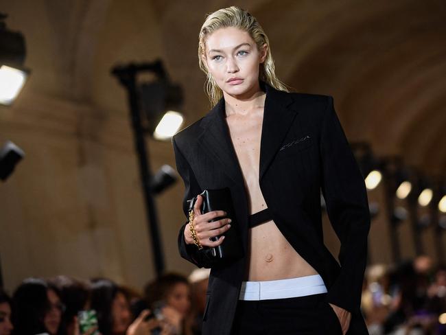 US model Gigi Hadid presents a creation for the Victoria Beckham Spring-Summer 2023 fashion show during the Paris Womenswear Fashion Week, in Paris, on September 30, 2022. (Photo by JULIEN DE ROSA / AFP)