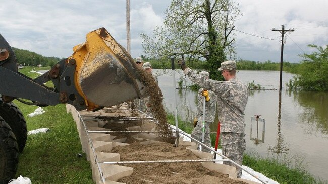 DefenCell barriers being erected by US military personnel.