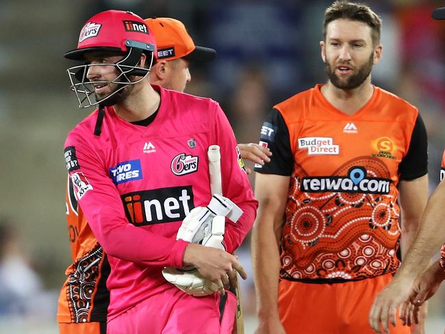 CANBERRA, AUSTRALIA - JANUARY 30: James Vince of the Sixers shows his frustration as he walks away from Andrew Tye of the Scorchers after Tye bowled wide that gave the Sixers the win and left Vince not out on 98 during the Big Bash League match between the Sydney Sixers and the Perth Scorchers at Manuka Oval, on January 30, 2021, in Canberra, Australia. (Photo by Mark Kolbe/Getty Images)