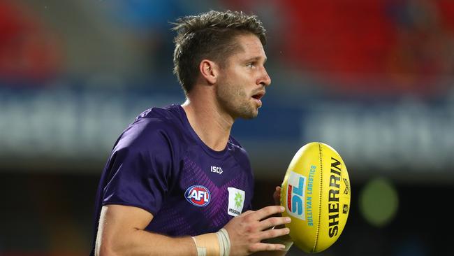 GOLD COAST, AUSTRALIA - JUNE 27: Jesse Hogan of the Dockers warms up before the round 4 AFL match between the Gold Coast Suns and Fremantle Dockers at Metricon Stadium on June 27, 2020 in Gold Coast, Australia. (Photo by Chris Hyde/Getty Images)