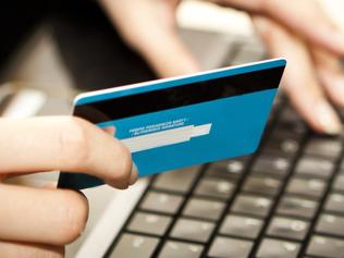 Online shopping with credit card on laptop