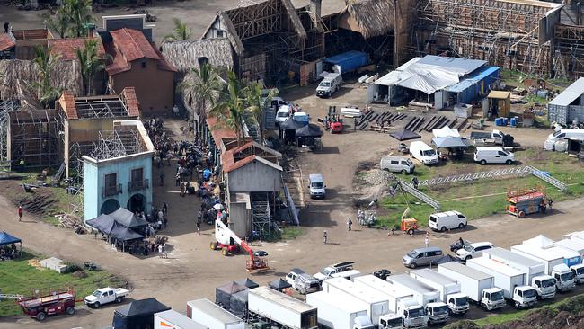 Trucks and vans loaded with equipment lined up at the back of the Pirates set. Picture Glenn Hampson.