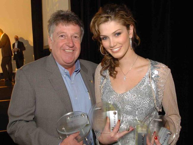 Denis Handlin and singer Delta Goodrem.