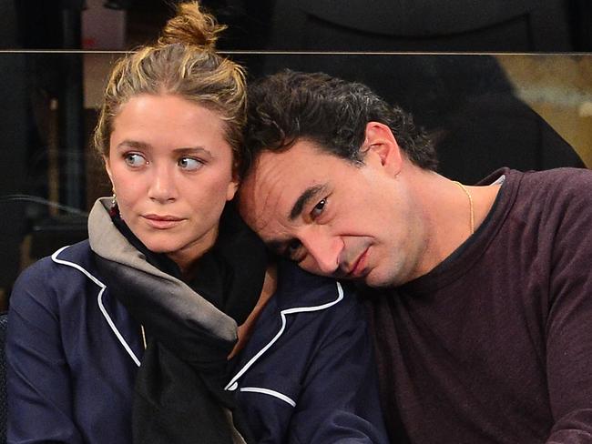 NEW YORK, NY - NOVEMBER 09:    Mary-Kate Olsen and Olivier Sarkozy attend the Dallas Mavericks vs New York Knicks game at Madison Square Garden on November 9, 2012 in New York City.  (Photo by James Devaney/WireImage)