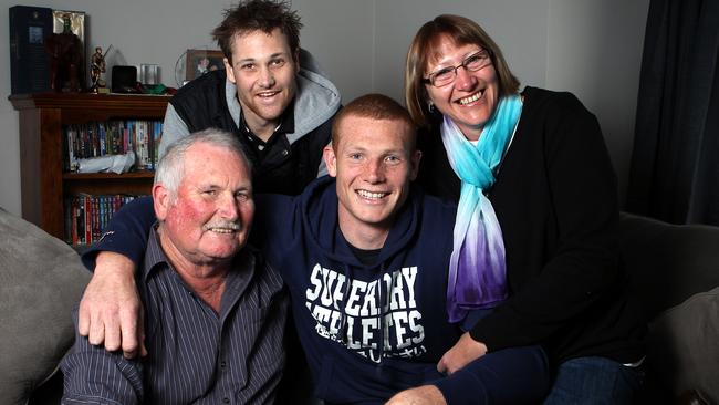 Sam Jacobs, pictured with his brother Aaron and parents Corrine and John.