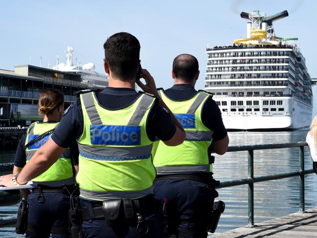 Police wait as the Carnival Legend docks at Station Pier in Melbourne last week. Picture: Nicole Garmston