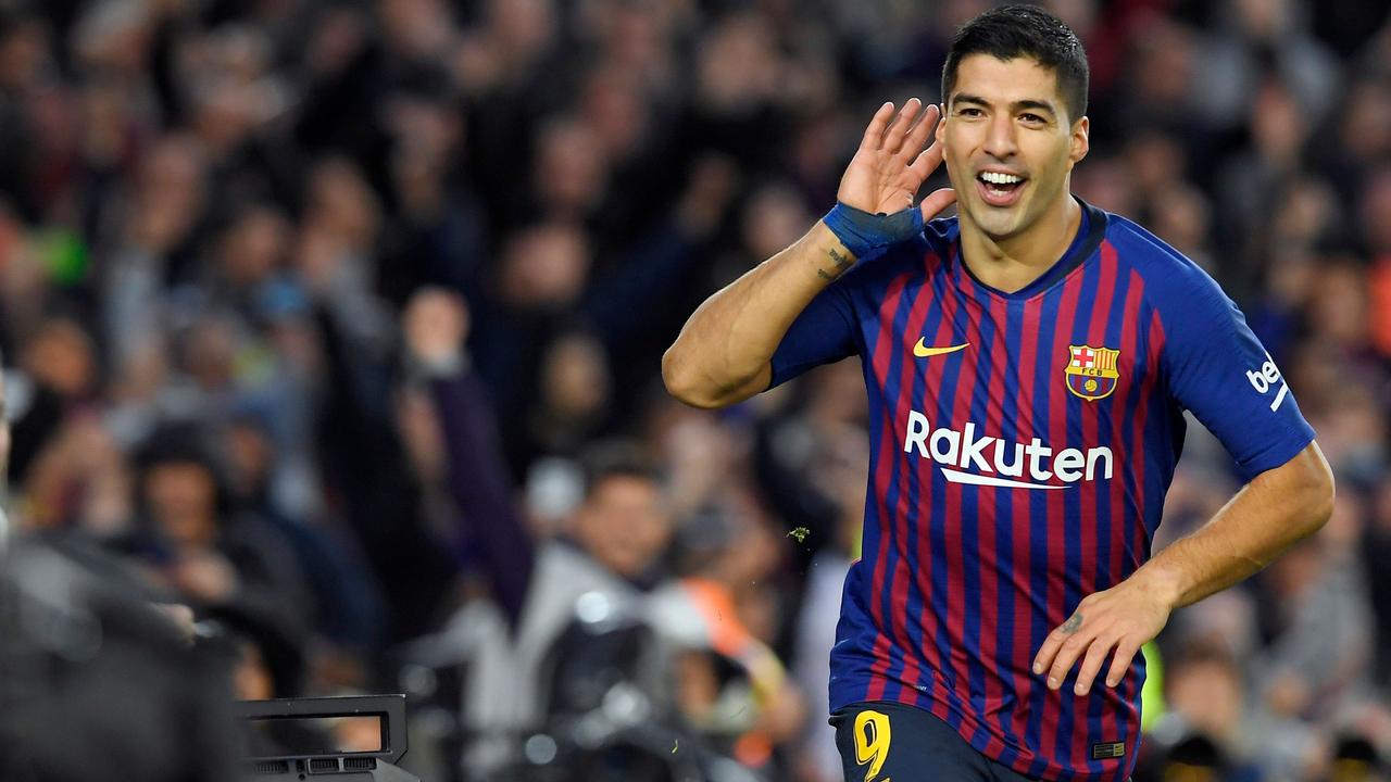 Barcelona's Luis Suarez celebrates. (Photo by LLUIS GENE / AFP)