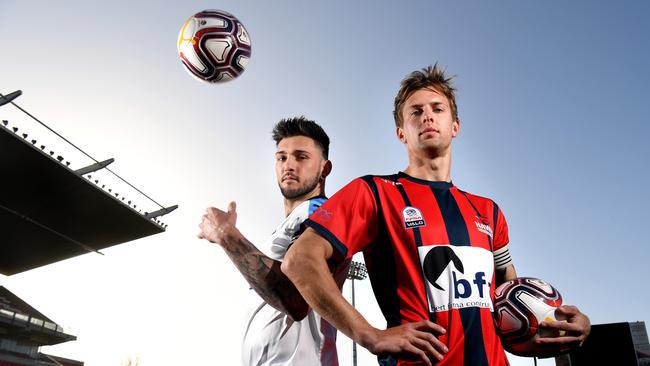 Vipers’ Alex Simic and Adelaide Hills’ Jake Loechel before last year’s State League Two grand final. The two clubs will battle again after both gaining promotion. Picture: Tricia Watkinson