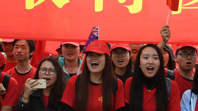 Supporters welcome Chinese Premier Li Keqiang to Parliament House in Canberra. Picture: AAP Image/Sam Mooy