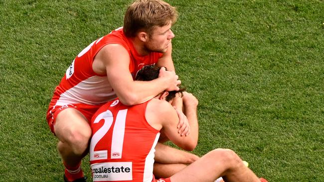 MELBOURNE, AUSTRALIA - SEPTEMBER 28:  A dejected Errol Gulden of the Swans is consoled by Braeden Campbell of the Swans during the 2024 AFL Grand Final match between the Sydney Swans and the Brisbane Lions at The Melbourne Cricket Ground on September 28, 2024 in Melbourne, Australia. (Photo by Adam Trafford/AFL Photos via Getty Images)