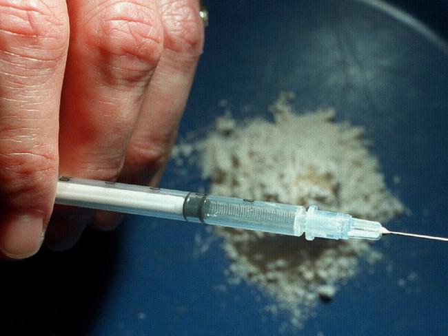 Generic photo of addict holding syringe ready for injection of heroin in Sydney, 03/11/1995.