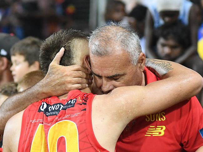 Joel Jeffrey embraces family after the match. Picture: Felicity Elliott/AFL Photos via Getty Images.