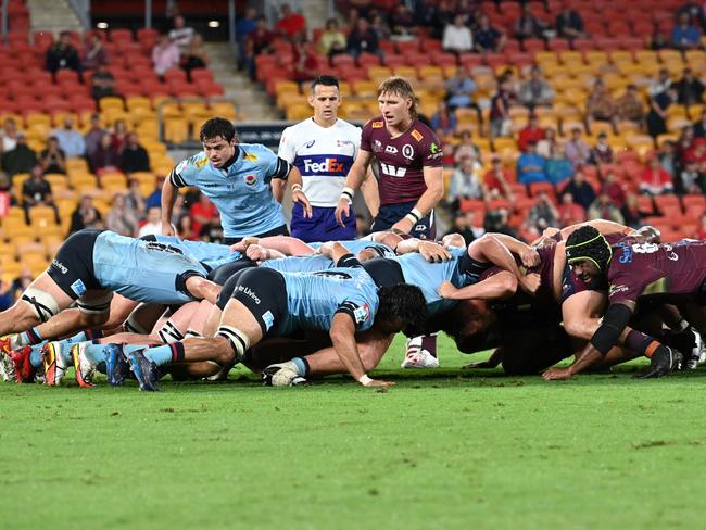 Reds halfback Tate McDermott (centre) stands over a scrum during his side’s win over the Waratahs at Suncorp Stadium. Picture: Dan Peled/Getty Images