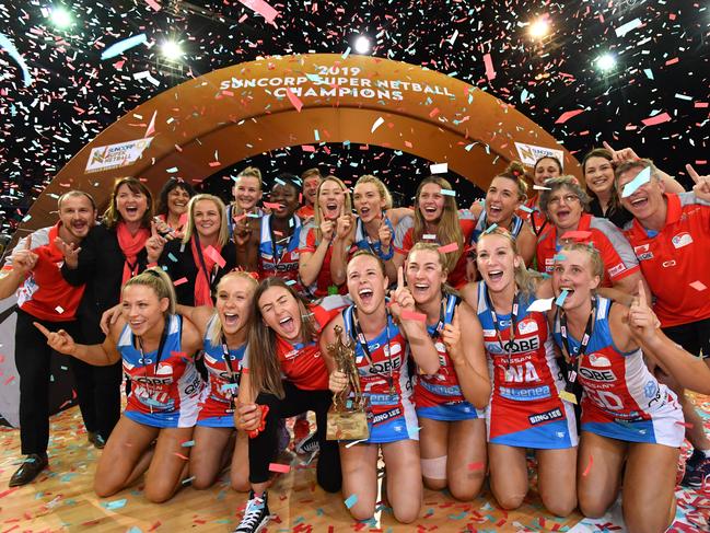 Swifts players celebrate winning the Super Netball Grand Final match between the Sunshine Coast Lightning and the New South Wales Swifts at the Brisbane Entertainment Centre in Brisbane, Sunday, September 15, 2019. (AAP Image/Darren England) NO ARCHIVING, EDITORIAL USE ONLY