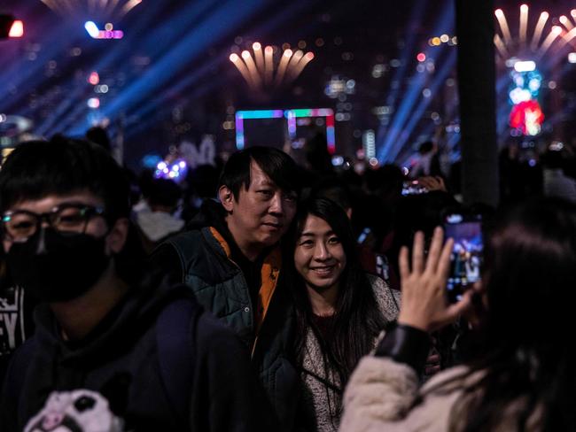 A couple ring in the new year in Hong Kong. Picture: AFP