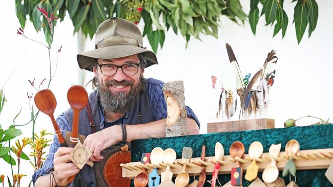 David Rauenbusch from Phoenix Creations with his hand-carved spoons. Picture: ZAK SIMMONDS