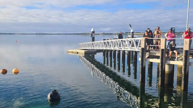 People waiting to watch the crews get to work to remove the submerged vehicle. Picture: Supplied/Kate Crumpet