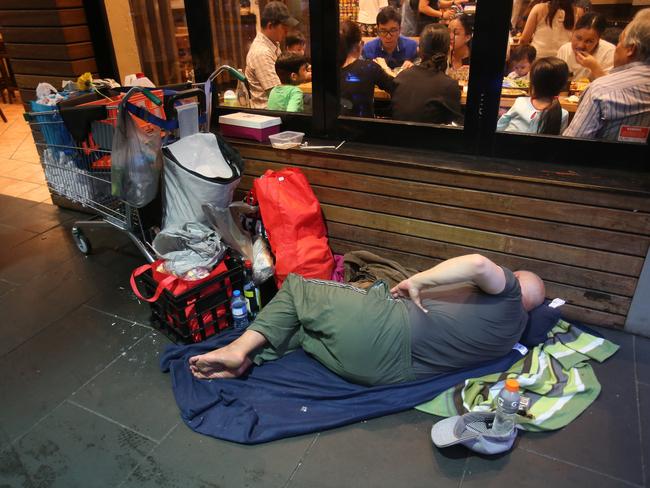 A homeless person on Swanston St, Melbourne, Picture: Yuri Kouzmin