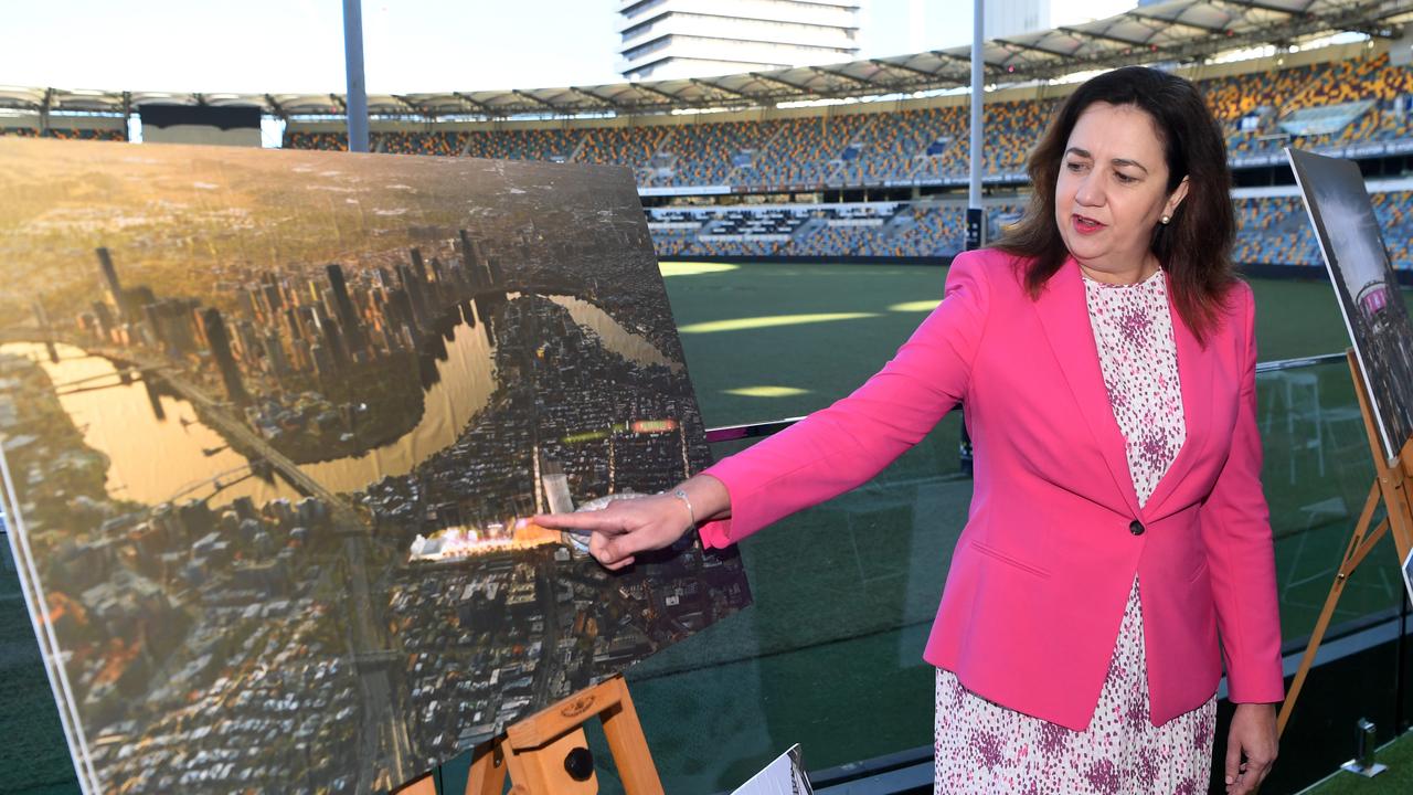 Premier Annastacia Palaszczuk looks at artist impressions before a press conference at the Gabba in Brisbane. The government announced a complete rebuild of the Gabba, being the proposed main stadium should Queensland host the 2032 Olympic and Paralympic Games. Picture: Dan Peled